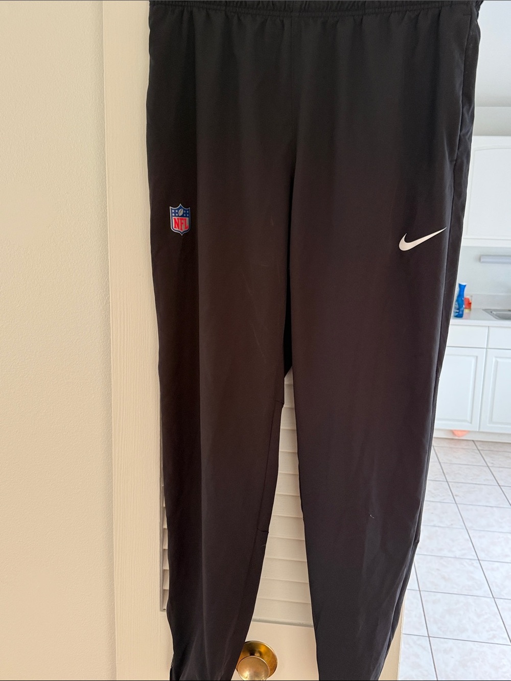 Nike Kids Black Track Joggers with White Swoosh and NFL Patch